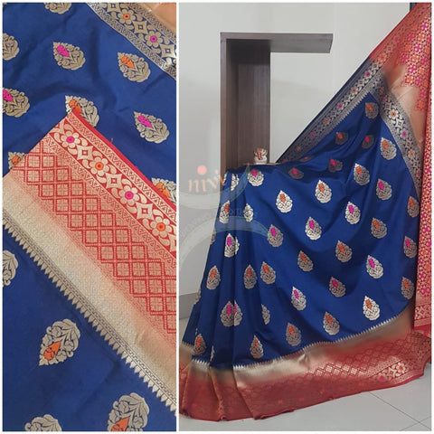 Royal blue dupion art silk brocade saree with contrast border and pallu.