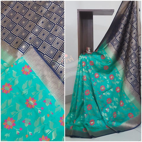 Sea green dupion art silk brocade saree with contrast border and pallu.