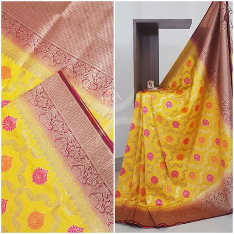 Yellow dupion art silk brocade saree with contrast border and pallu.