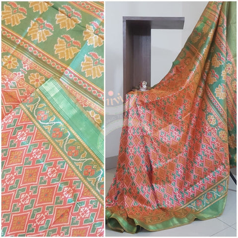 Orange Patola art silk printed saree with contrast blouse piece and tissue border