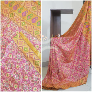 Peachish pink Patola art silk printed saree with contrast blouse piece.