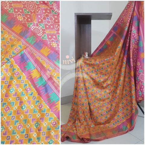 Yellow Patola art silk printed saree with contrast blouse piece.