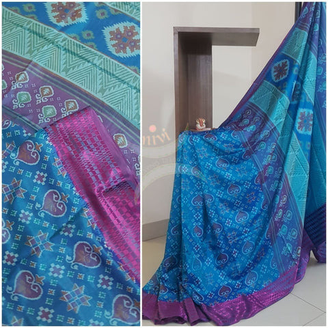 Blue Patola art silk printed saree with contrast blouse piece.