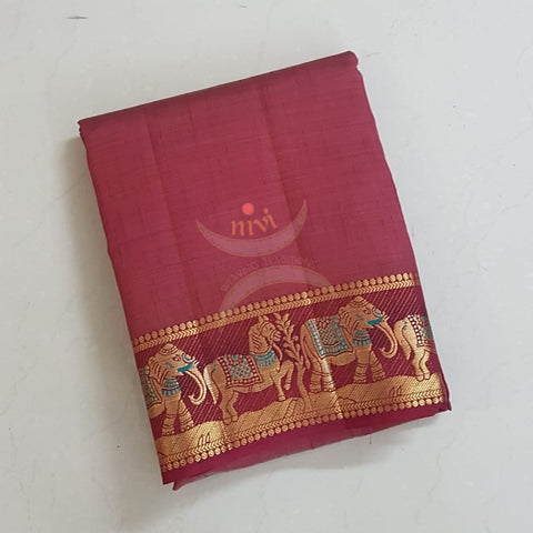 Maroon Art silk tussar with traditional border and zari woven pallu