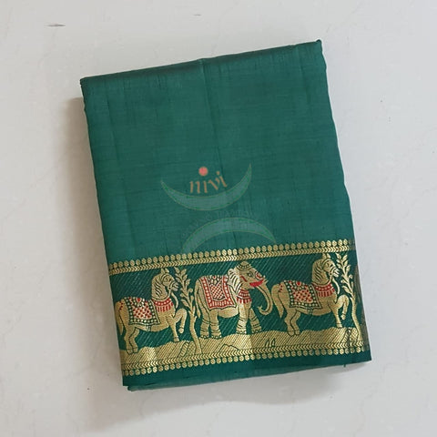 Bottle green Art silk tussar with traditional border and zari woven pallu