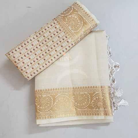 Off white Art silk tussar with traditional border and brocade woven pallu