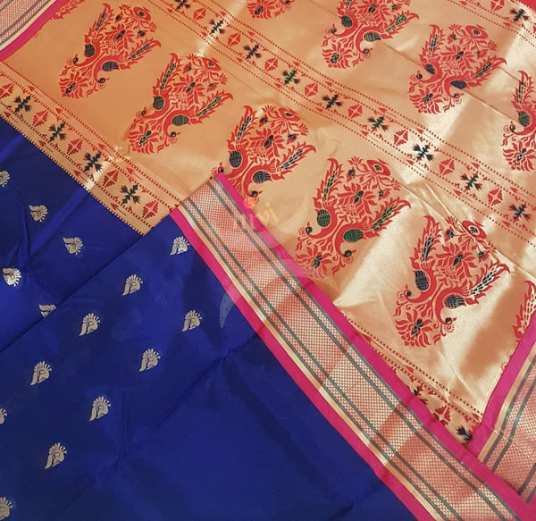 Royal blue silk paithani with contrasting pallu and blouse.