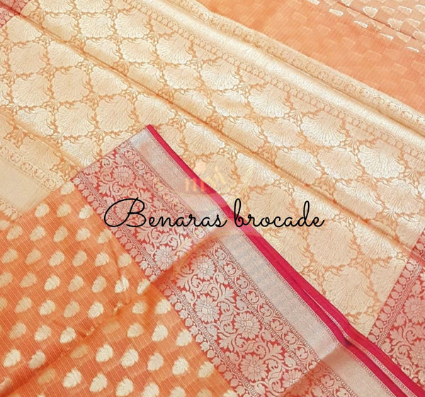 Orange silk cotton benaras brocade with antique zari  butties on body, pallu and border.