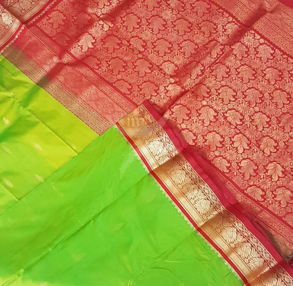 Green with maroon red handloom small Ghatti border pure south silk Saree.