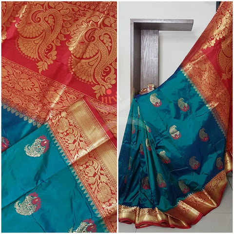 Teal with red pure handloom silk with traditional paisley booties all over and intricate floral motifs on pallu and border.