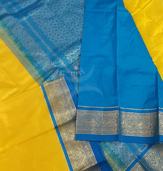 Yellow with blue handloom small Ghatti border pure south silk saree.