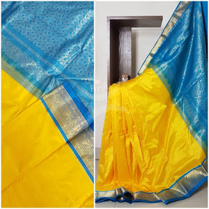 Yellow with blue handloom small Ghatti border pure south silk saree.