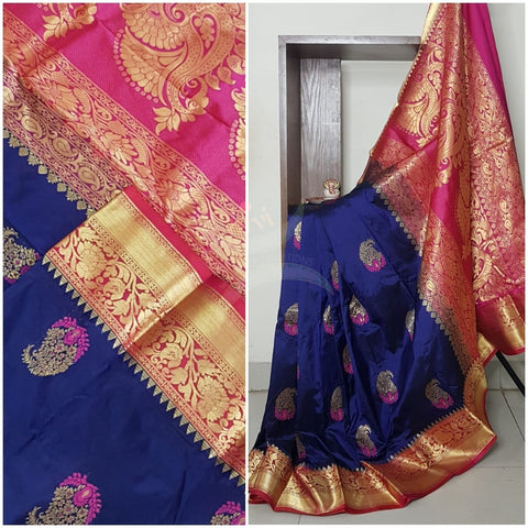 Royal blue with pink pure handloom silk with traditional paisley booties all over and intricate floral motifs on pallu and border.