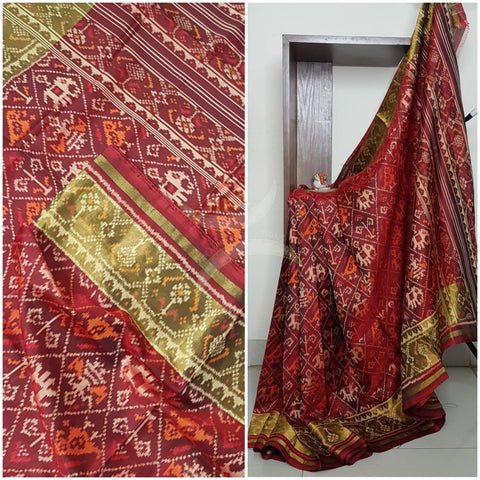 Redish Maroon Handloom patan patola silk saree with intricate woven pattern and subtle gold zari.
