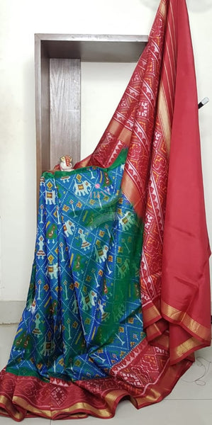 Teal blue Handloom patan patola silk saree with intricate woven pattern and subtle gold zari.