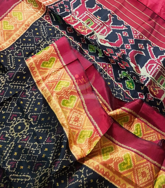 Black Handloom patan patola silk saree with intricate woven pattern and subtle gold zari.