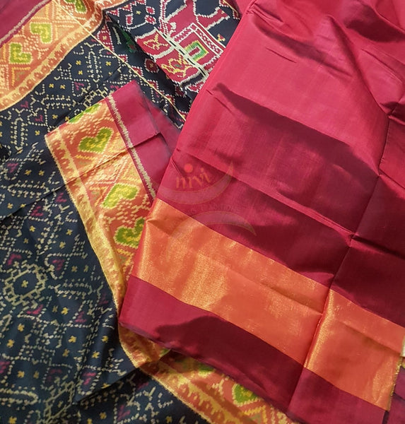 Black Handloom patan patola silk saree with intricate woven pattern and subtle gold zari.