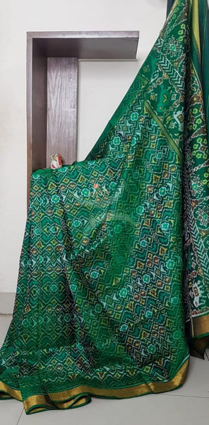 Teal Green Handloom patan patola silk saree with intricate woven pattern and subtle gold zari.