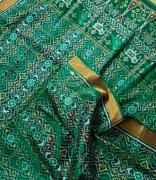 Teal Green Handloom patan patola silk saree with intricate woven pattern and subtle gold zari.