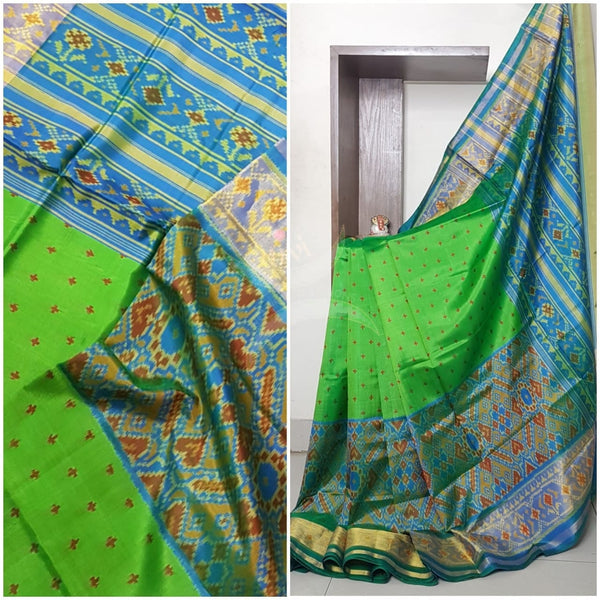 Green Handloom patan patola silk saree with intricate woven pattern and subtle gold zari.