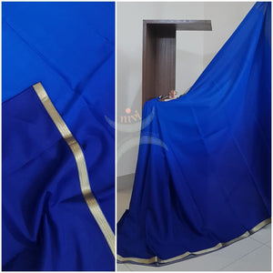50 gms Two Tone pure Silk Crepe in shades of Royal blue with a fine zari border. Saree comes with pure Royal blue crepe blouse in darker tone.
