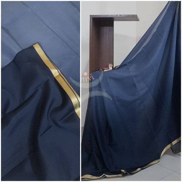 50 gms Two Tone pure Silk Crepe in shades of Grey with a fine zari border. Saree comes with pure Grey crepe blouse in darker tone.