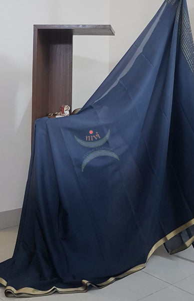 50 gms Two Tone pure Silk Crepe in shades of Grey with a fine zari border. Saree comes with pure Grey crepe blouse in darker tone.