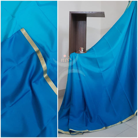 50 gms Two Tone pure Silk Crepe in shades of blue with a fine zari border. Saree comes with pure blue crepe blouse in darker tone.