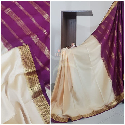 Cream with purple 50 grams pure mysore silk crepe with traditional border and striped pallu. Saree comes with plain purple blouse matching pallu.