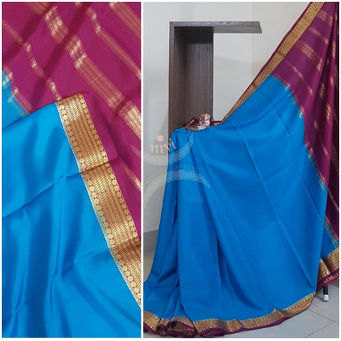 Blue with mejanta 50 grams pure mysore silk crepe with traditional border and striped pallu. Saree comes with plain mejanta blouse matching pallu.