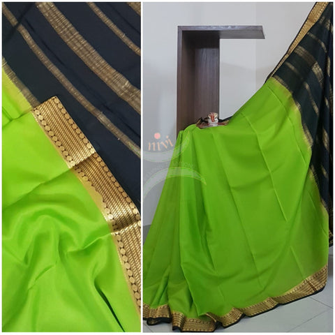 Green with black 50 grams pure mysore silk crepe with traditional border and striped pallu. Saree comes with plain black blouse matching pallu.