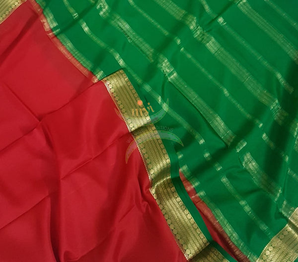 Red with Green 50 grams pure mysore silk crepe with traditional border and striped pallu. Saree comes with plain green blouse matching pallu.