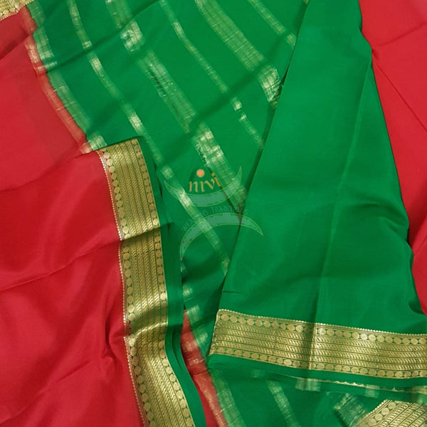 Red with Green 50 grams pure mysore silk crepe with traditional border and striped pallu. Saree comes with plain green blouse matching pallu.