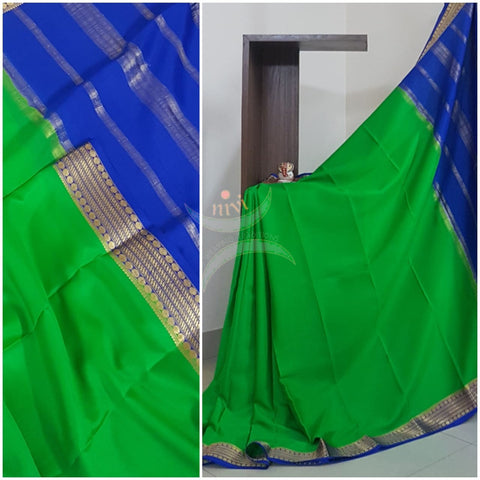 Green with royal blue 50 grams pure mysore silk crepe with traditional border and striped pallu. Saree comes with plain royal blue blouse matching pallu.