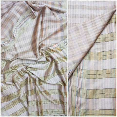 Cream bagalpuri tussar with self woven chequared pattern.