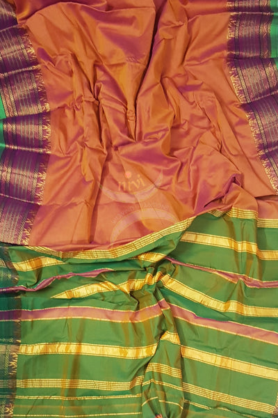 Orange dharwad cotton merserised cotton with traditional green border.