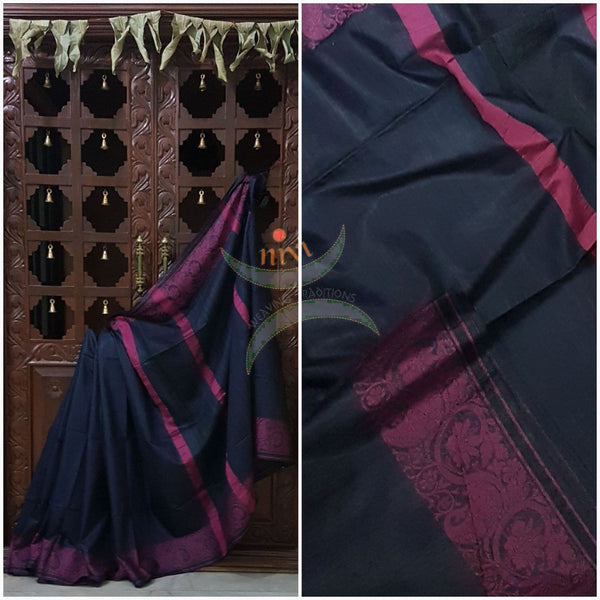 Navy blue with pink handloom cotton saree with traditional paisley woven border and striped pallu.