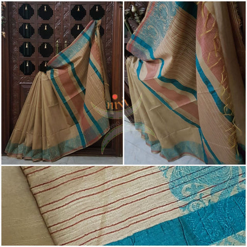 Beige with blue handloom cotton saree with traditional paisley woven border and striped pallu.