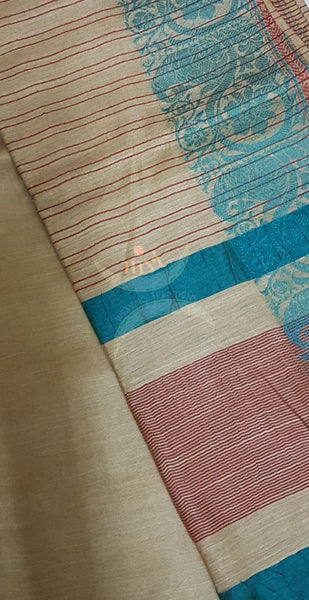 Beige with blue handloom cotton saree with traditional paisley woven border and striped pallu.