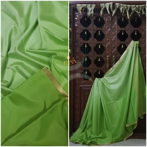 Pista Green 50 gms Two Tone waterproof pure Silk Crepe with a fine zari border. Saree comes with pure pista green crepe blouse in darker tone.