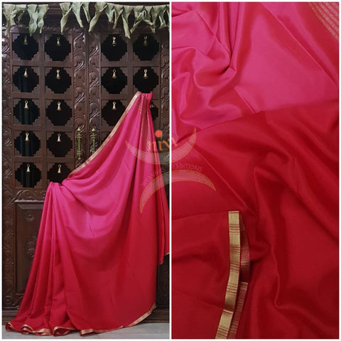 Pink 50 gms Two Tone waterproof pure Silk Crepe with a fine zari border. Saree comes with pure pink crepe blouse in darker tone.
