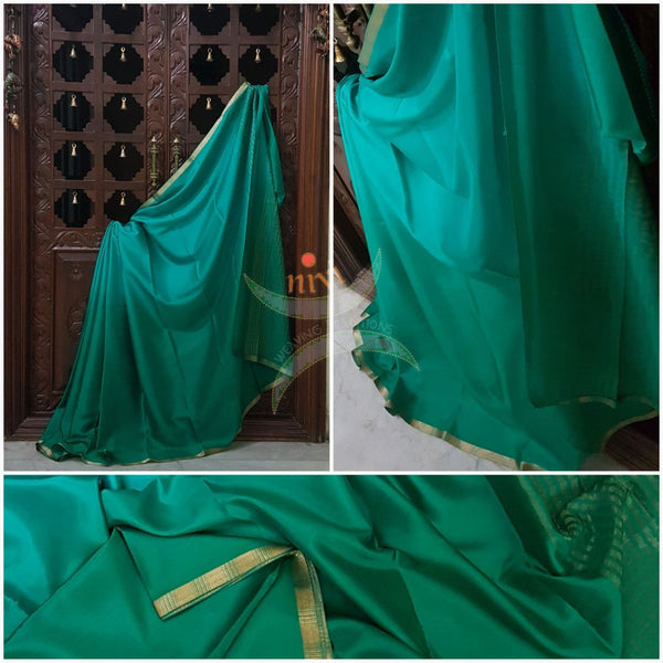 Green 50 gms Two Tone waterproof pure Silk Crepe with a fine zari border. Saree comes with green crepe blouse in darker tone.