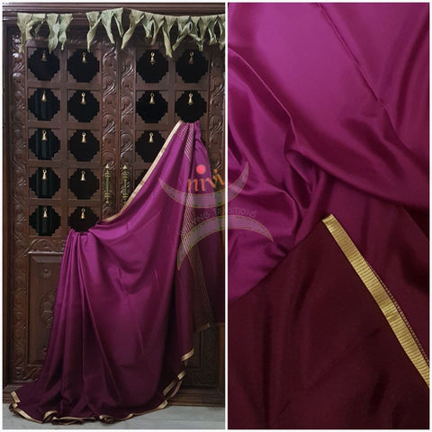 Wine 50 gms Two Tone waterproof pure Silk Crepe with a fine zari border. Saree comes with wine crepe blouse in darker tone.