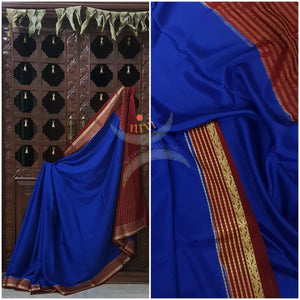 Royal blue with maroon 60 grams waterproof pure mysore silk crepe with traditional border and striped pallu. Saree comes with plain maroon blouse matching pallu.