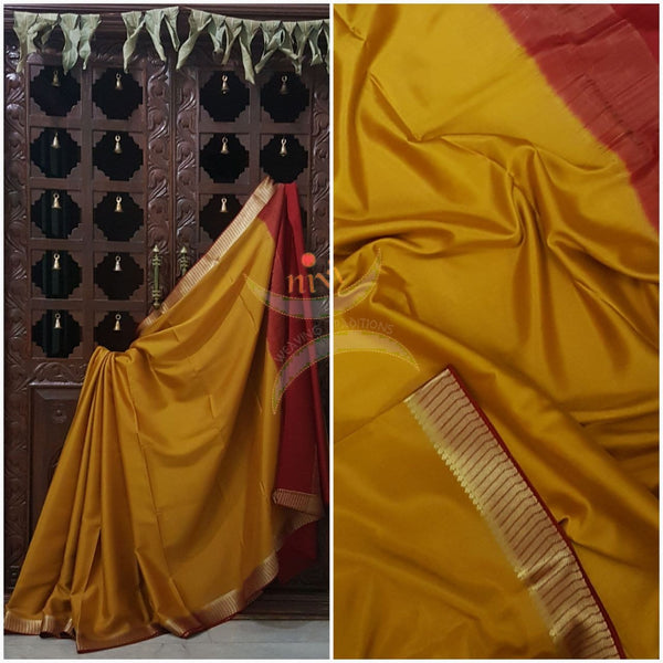 Mustard with red 60 grams waterproof pure mysore silk crepe with traditional border and striped pallu. Saree comes with plain red blouse matching pallu.