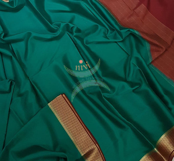 Teal with maroon 60 grams waterproof pure mysore silk crepe with traditional border and striped pallu. Saree comes with plain maroon blouse matching pallu.