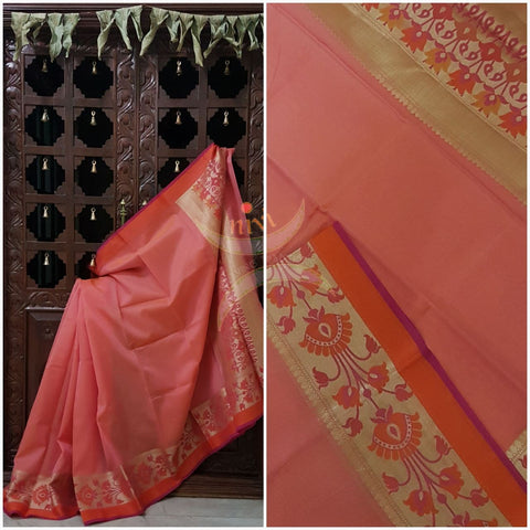 Peach silk Cotton Brocade saree with floral motifs woven on border and on the pallu of the saree.