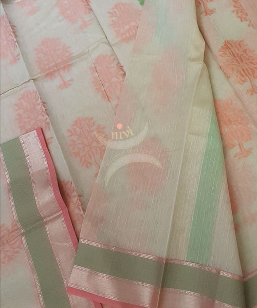 Beige silk Cotton saree with woven floral motifs and contrast sea green and peach border and pallu .