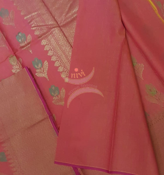 Peach shot pink Linen slub Cotton Benaras Brocade saree with floral motifs and antique zari weaving all over the saree.
