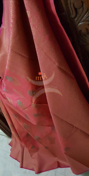 Peach shot pink Linen slub Cotton Benaras Brocade saree with floral motifs and antique zari weaving all over the saree.
